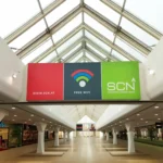 Leuchtschild mit bedruckter Spanntuchfront in Einkaufszentrum